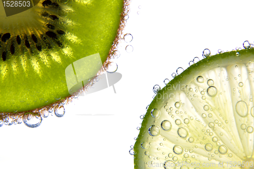 Image of Lemon and kiwi slices with bubbles 