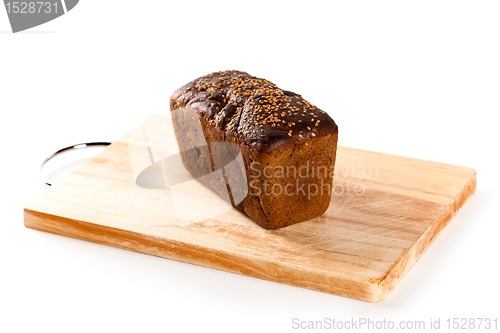 Image of fresh bread on the wooden board 