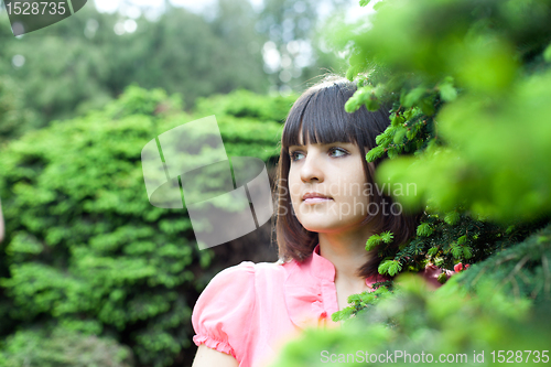 Image of beautiful young woman in the forest