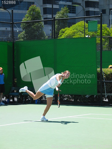 Image of Female Tennis player serving