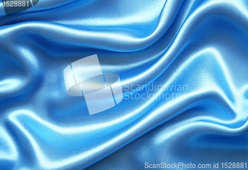 Image of Smooth elegant blue silk as background 