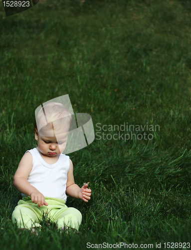 Image of Liitle boy on a grass
