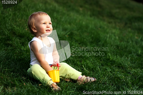 Image of Little boy on a grass