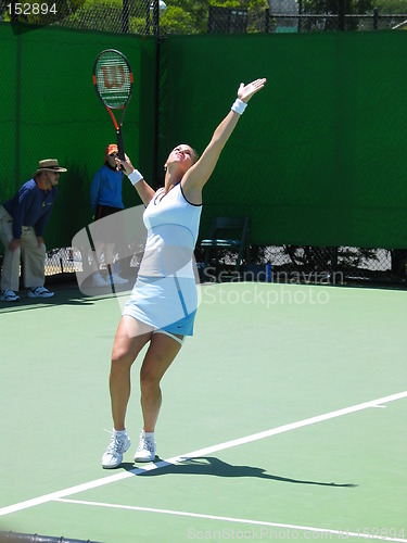 Image of Female Tennis player serving