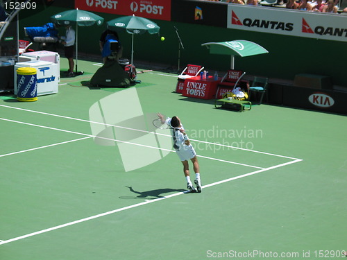 Image of Male tennis player serving