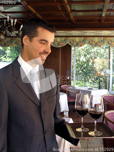 Image of Butler is serving wine 3