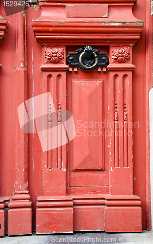 Image of Vintage red wooden door with metal handle backdrop 