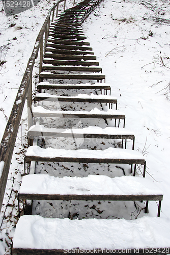 Image of Stairs covered snow leading steep hill winter 