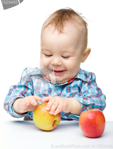 Image of Little child with apple