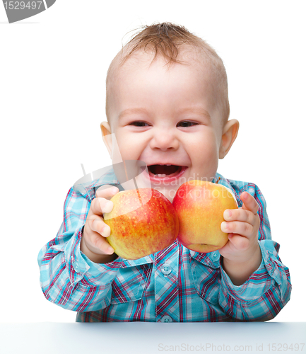 Image of Little child with apple