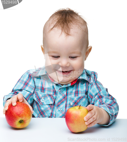 Image of Little child with apple