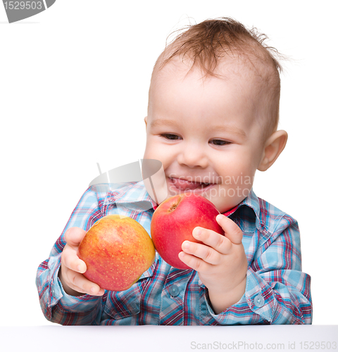 Image of Little child with apple