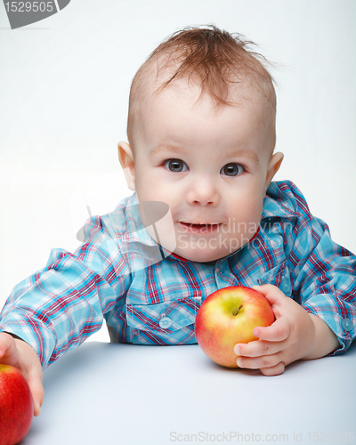 Image of Little child with apple