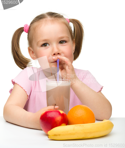 Image of Little girl drinks fruit juice