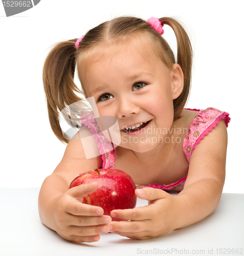 Image of Portrait of a little girl with apple