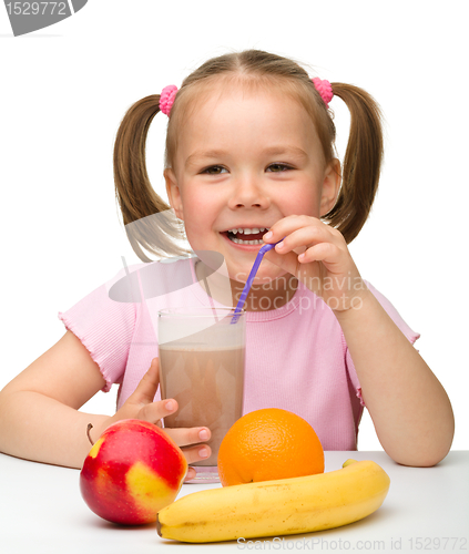 Image of Little girl drinks fruit juice