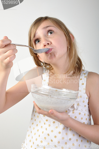 Image of child eating milk porridge