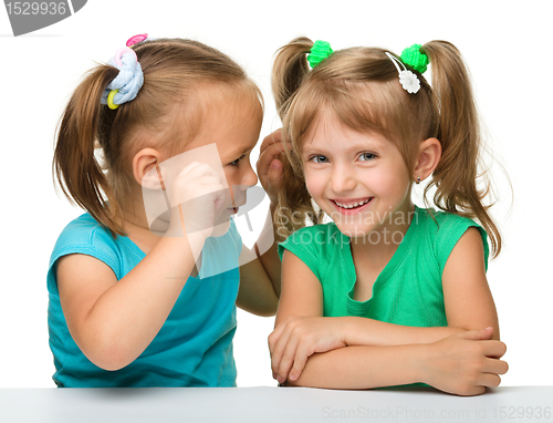 Image of Two little girls are chatting