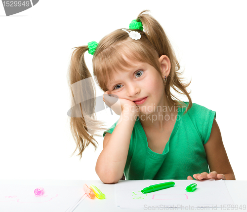 Image of Cute little girl is tired with drawing