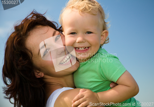 Image of Child with mother play outdoors