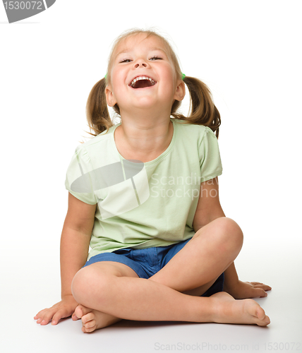 Image of Portrait of a cute little girl laughing