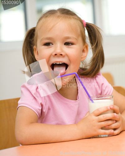 Image of Little girl is drinking milk