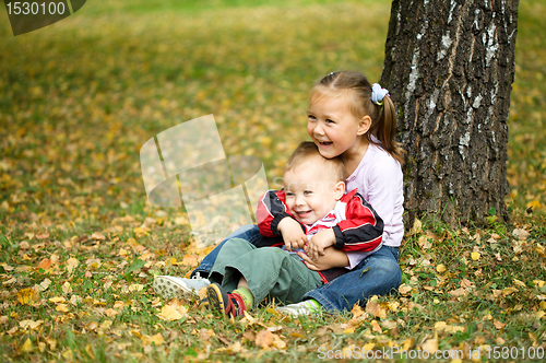 Image of Children are playing in autumn park