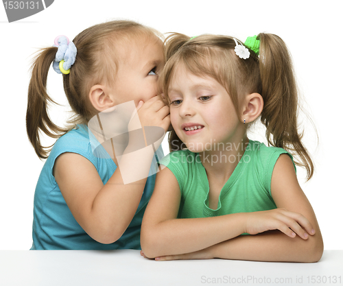 Image of Two little girls are chatting