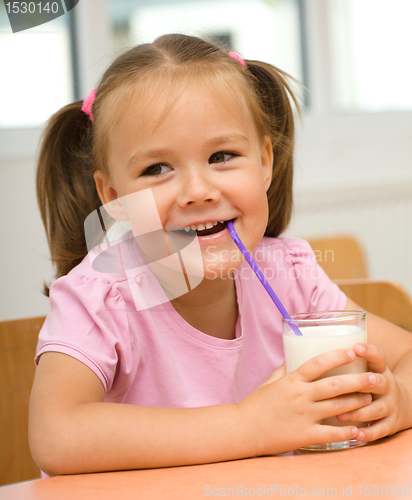 Image of Little girl is drinking milk
