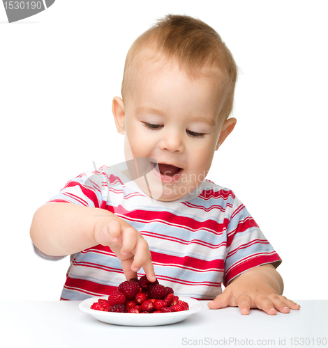 Image of Cute little boy with strawberries