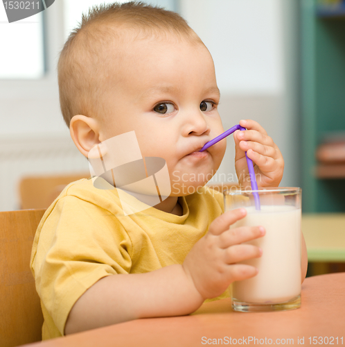 Image of Little boy is drinking milk