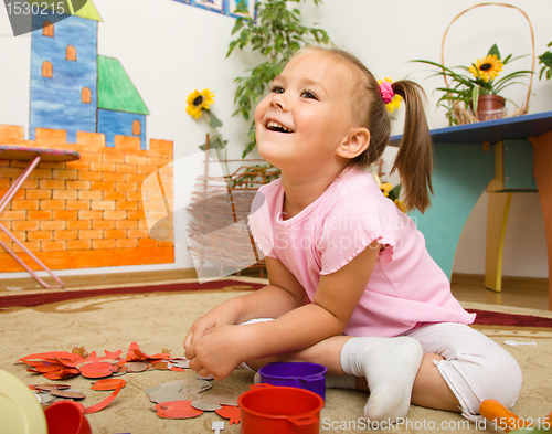 Image of Little girl is playing in preschool