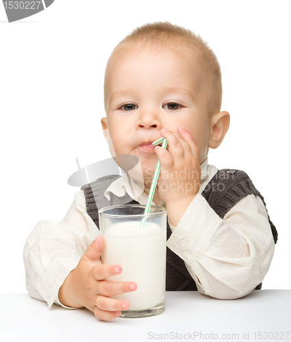 Image of Cute little boy is drinking milk