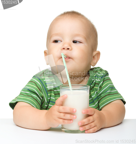 Image of Cute little boy is drinking milk