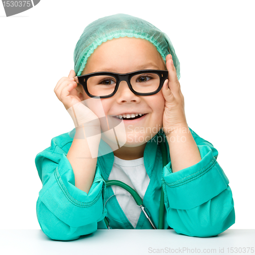 Image of Little girl is playing doctor with stethoscope