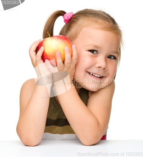 Image of Little girl with red apple