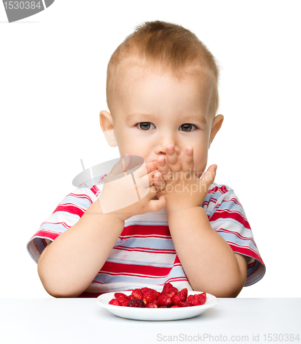 Image of Cute little boy with strawberries
