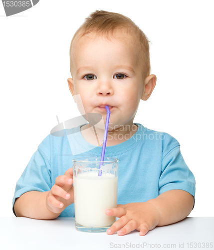 Image of Cute little boy is drinking milk