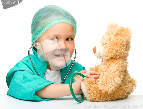 Image of Little girl is playing doctor with stethoscope