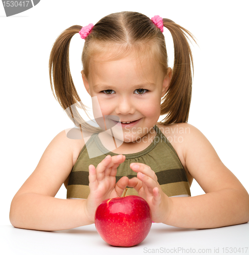 Image of Little girl with red apple