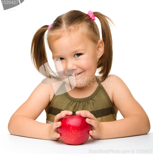 Image of Little girl with red apple