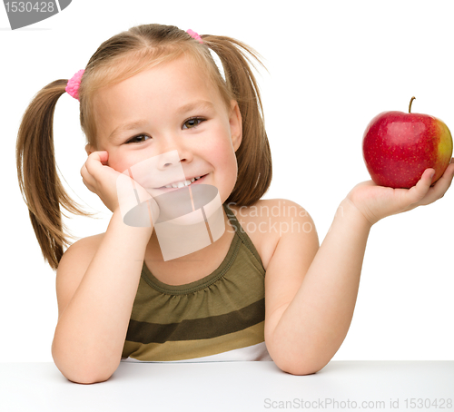 Image of Little girl with red apple