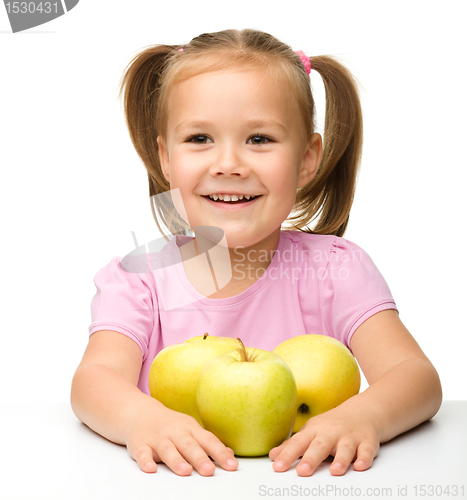 Image of Little girl with apples