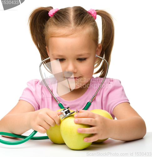 Image of Little girl with apples