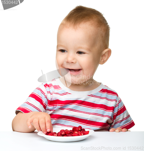 Image of Cute little boy with strawberries