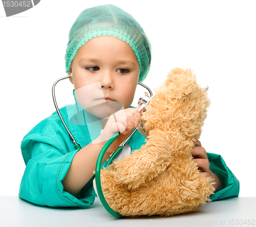 Image of Little girl is playing doctor with stethoscope