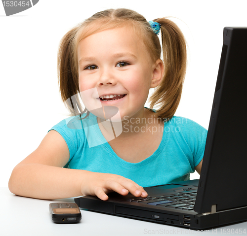 Image of Little girl with laptop