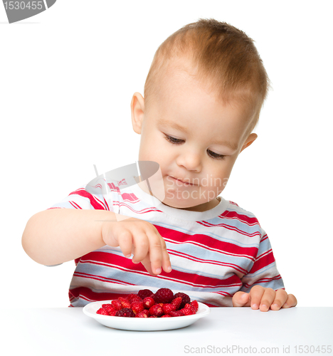 Image of Cute little boy with strawberries