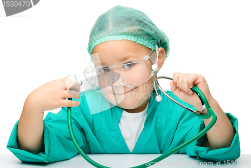 Image of Little girl is playing doctor with stethoscope