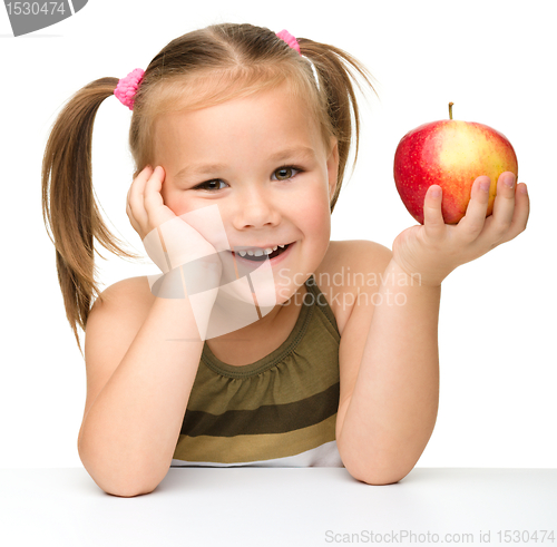 Image of Little girl with red apple